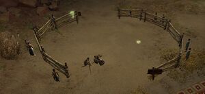 A screenshot of the Sun's Refuge Arena, from the outside. The arena is circled by an wooden fence. When no players are inside the arena, two sunspear NPCs are sparring and several NPC spectators watch from the outside.